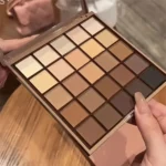 25-color eyeshadow palette - neutral gray and brown earth tones, coffee and chocolate shades, creating versatile, natural to dramatic makeup looks